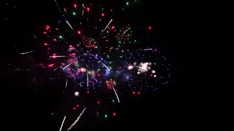 Colorful Fireworks Exploding in the Night Sky Creating Bright Light Patterns in Video stock 339167434