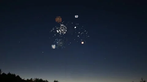 Colorful Fireworks Exploding in the Night Sky with Stars Stock Footage 340675896