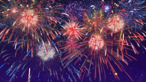 Colorful fireworks exploding in the night sky during a festive celebration with Video stock 345807577