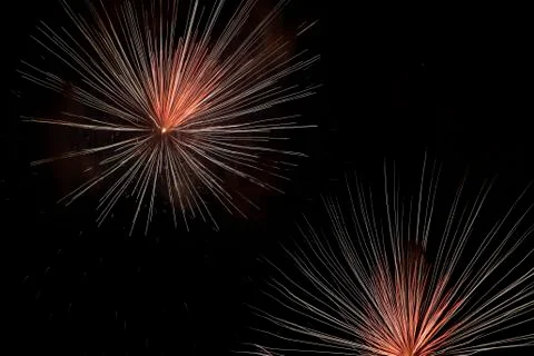 Colorful fireworks exploding in night sky Stock Photos