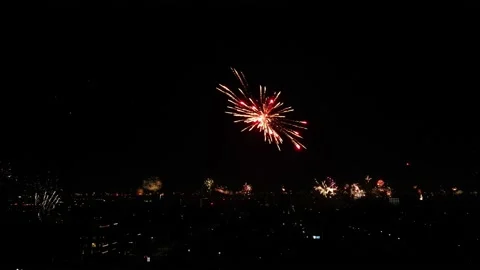 Colorful Fireworks Exploding Over Evening Sky At City Day Festival. Stock Footage 232502172