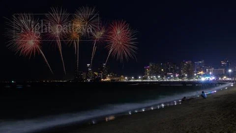 Colorful Fireworks Exploding Over Illuminated Pattaya Coastal City Skyline .. Stock Photos