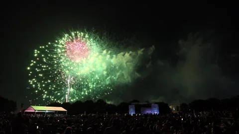 Colorful fireworks exploding over a large crowd at night Stock-Footage 340941549
