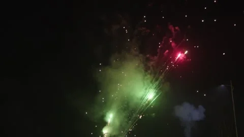 Colorful Fireworks Exploding Over Night Sky with Smoke Trails Stock Footage 337414271