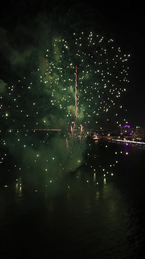 Colorful Fireworks Exploding Over the Sea at Night in Pattaya, Thailand Video stock 335842769