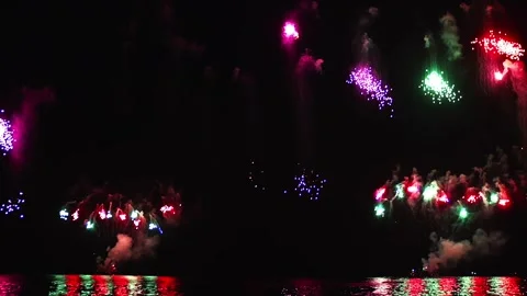 Colorful Fireworks Exploding Over the Sea at Night Celebration Show Video stock 346247885