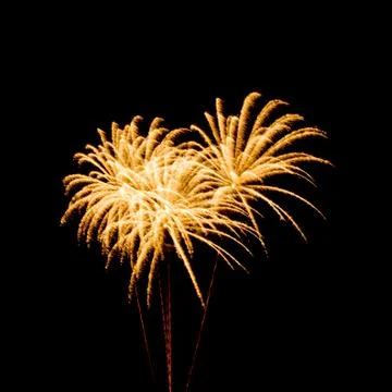 Colorful fireworks over dark sky background Stock Photos