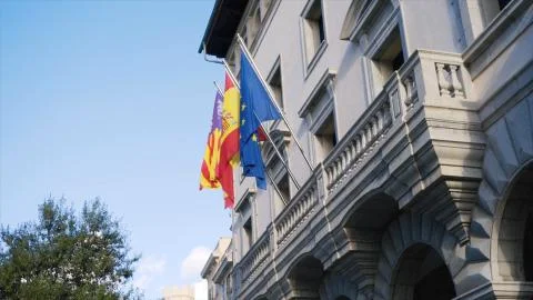 Colorful flags from different countries on building background. Stock. Flags of Fotos de archivo