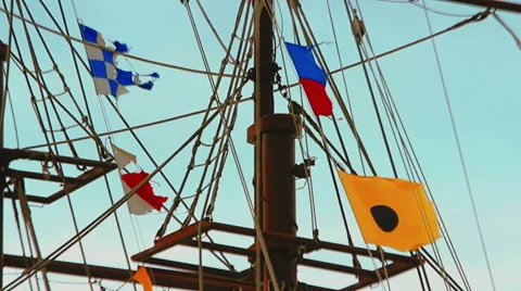 Colorful flags fluttering in the wind on the rigging Stock Footage 61073733