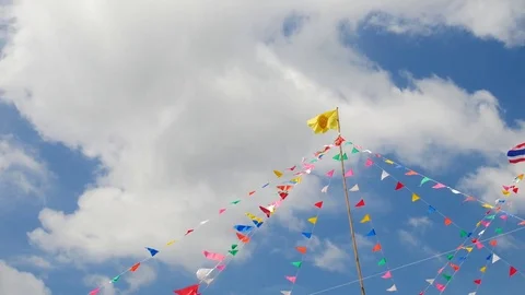 Colorful flags in the templ with blue sky background. Видео 72450180