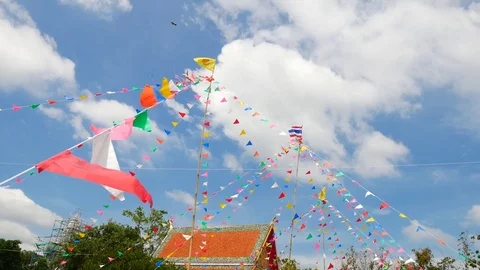 Colorful flags in the templ with blue sky background. Video stock 72450248