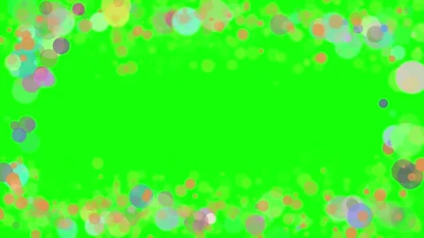 Colorful floating bubbles moving in a circular pattern against a bright green sc 스톡 동영상 335673864