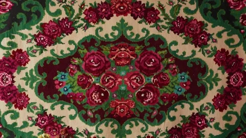 Colorful floral patterned textile featuring intricate roses and green foliage, Stock Footage 332724128