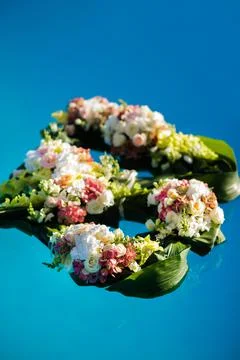 Colorful flowers float in the pool Stock Photos