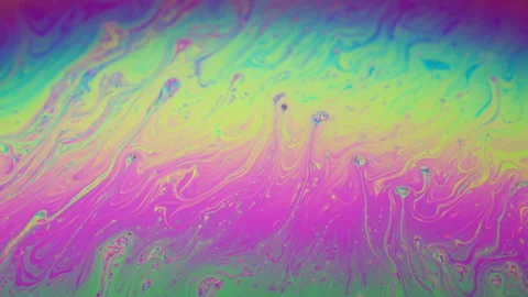 Colorful, flowing liquid with a rainbow effect. 動画素材 307438308