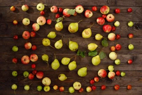 Colorful frame a fruit pattern of fresh red autumnal apples on a wooden backg Stock Photos