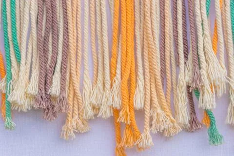 Colorful frayed macrame threads texture for background. Close up. Stock Photos