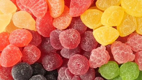 Colorful fruit flavored soft gummy candy rotating Stock Footage 342437862