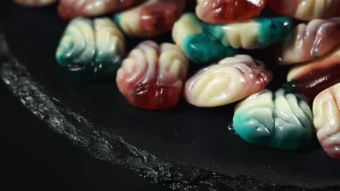 Colorful fruit jelly candy in the shape of brain Stock Footage 314773766