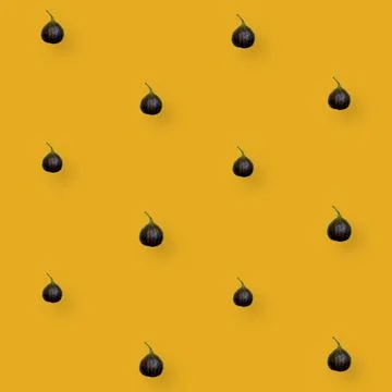Colorful fruit pattern of fresh figs on orange background. Top view. Flat lay Stock Photos