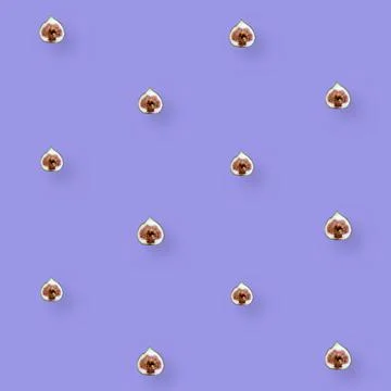 Colorful fruit pattern of fresh figs sliced on purple background. Top view. Flat Stock Photos