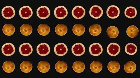 Colorful fruit pattern of fresh grapefruits on black background. Seamless Stock Footage 167478820