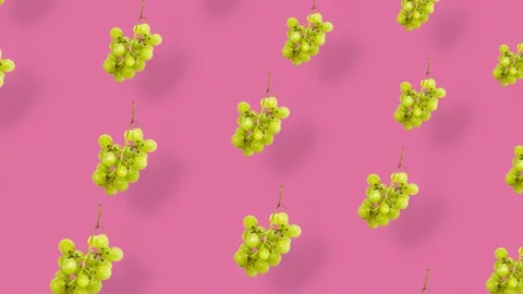 Colorful fruit pattern of fresh grapes on pink background with shadows. Seamless Stock Footage 167486577
