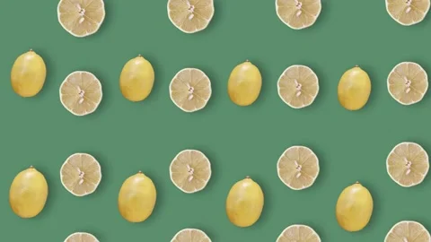 Colorful fruit pattern of fresh lemons on green background with shadows Stock Footage 167478039
