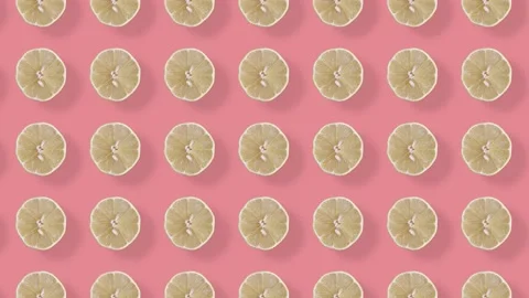 Colorful fruit pattern of fresh lemons on pink background with shadows. Seamless Stock Footage 167487809