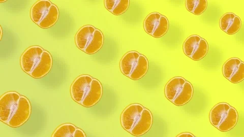 Colorful fruit pattern of fresh orange on yellow background with shadows Stock Footage 167479250