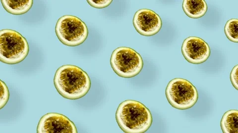 Colorful fruit pattern of fresh passion fruit on blue background with shadows Stock Footage 167487016