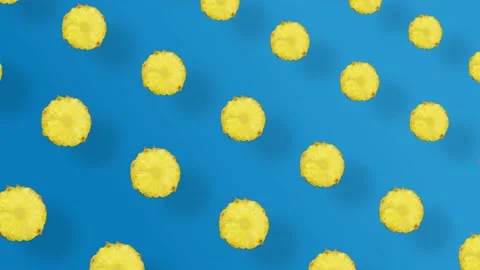 Colorful fruit pattern of fresh pineapple on blue background with shadows 動画素材 167486479