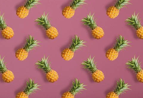 Colorful fruit pattern of fresh pineapples Stock Photos