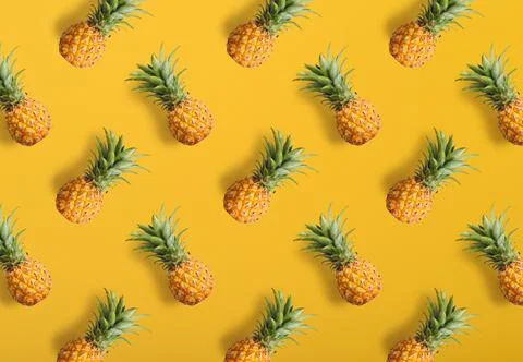 Colorful fruit pattern of fresh pineapples Stock Photos