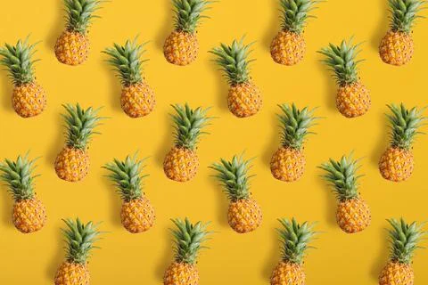 Colorful fruit pattern of fresh pineapples Stock Photos