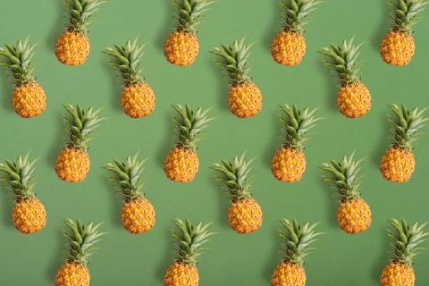 Colorful fruit pattern of fresh pineapples Stock Photos