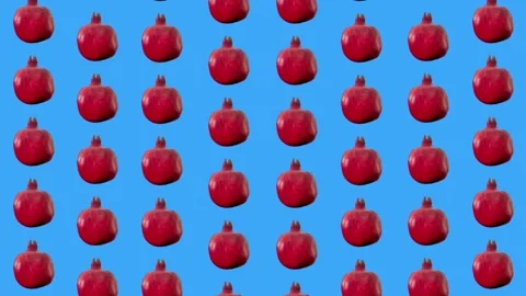 Colorful fruit pattern of fresh red pomegranates on blue background. Seamless Stock Footage 167484535