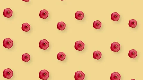 Colorful fruit pattern of fresh red pomegranates on orange background with Stock Footage 167486304