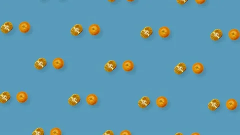 Colorful fruit pattern of fresh rotating tangerines on blue background. Seamless Stock Footage 167475402