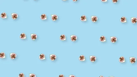 Colorful fruit pattern of fresh rotating figs on blue background. Seamless Video stock 167484253
