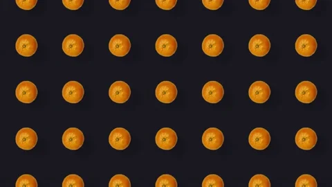Colorful fruit pattern of fresh tangerines on black background. Seamless pattern Stock Footage 167487110
