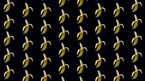 Colorful fruit pattern of fresh yellow bananas on black background. Seamless Stock Footage 167475947