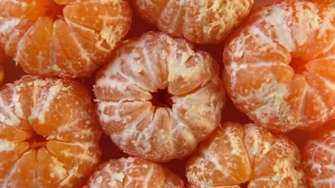 Colorful fruit pattern of tangerine or clementine is spinning, turning Stock Footage 256197512