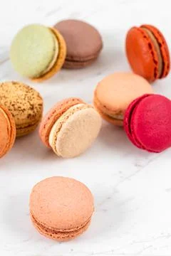 Colorful Fruity Macarons Flat Lay and Top View on White Marble Table Stock Photos