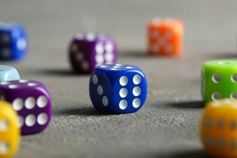 Colorful game dices on grey background, closeup Stock Photos