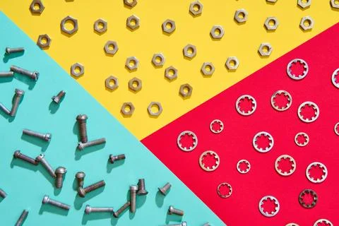 Colorful geometric hardware layout with nuts bolts and washers Stock-Fotos