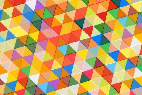 Colorful geometric pattern of small triangles in bright shades Stock Photos