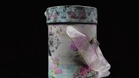 A colorful gift box, rotating 360 degree on a display stand. Stock Footage 263044068