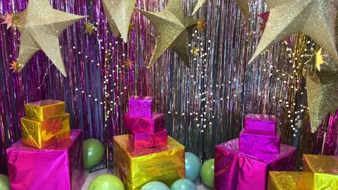 Colorful gift boxes on a background of tinsel and stars Stock Footage 255471191