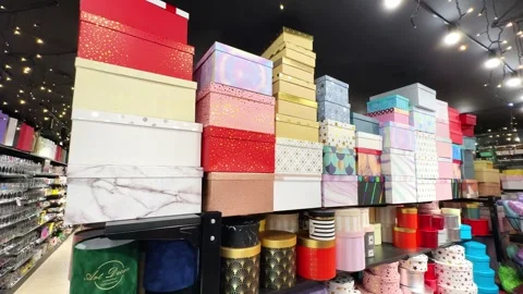 Colorful gift boxes on a shelf in a gift shop Stock Footage 255619741